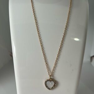 Necklace with Mother of pearl heart bordered with small pave crystals